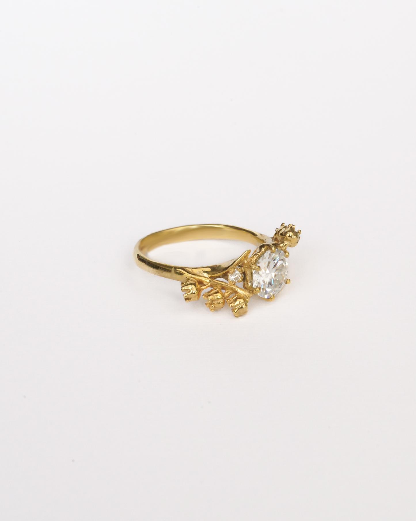 Lily of the Valley Solitaire Ring with Round Stone in 18K Gold